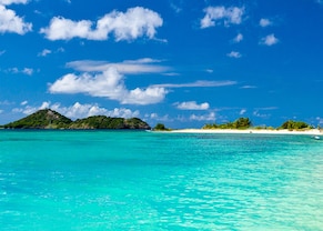 float in the crystal clear blue water of grenada