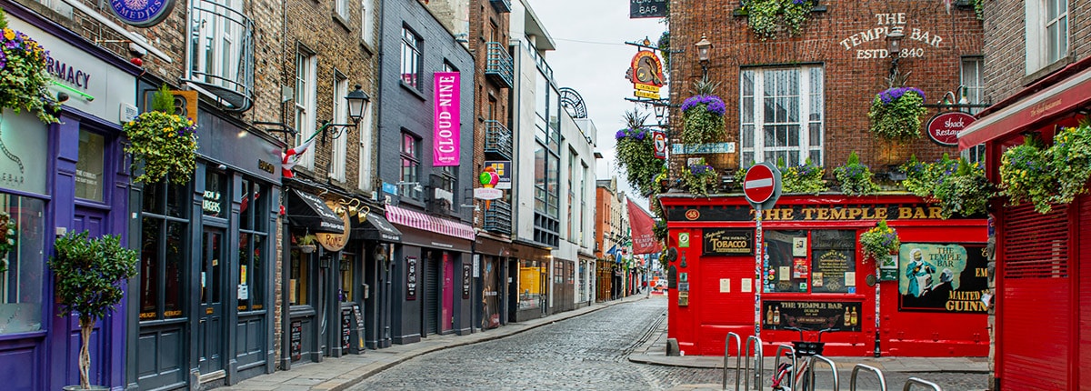colorful buildings line a block in dublin