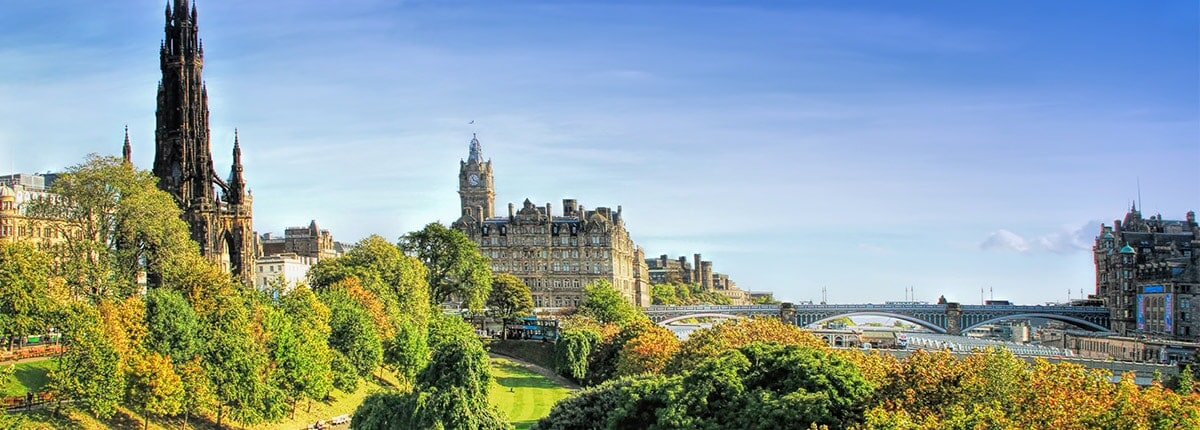 beautiful view of princes street gardens on a bright, sunny day in edinburgh, scotland
