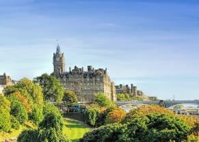 beautiful view of princes street gardens on a bright, sunny day in edinburgh, scotland