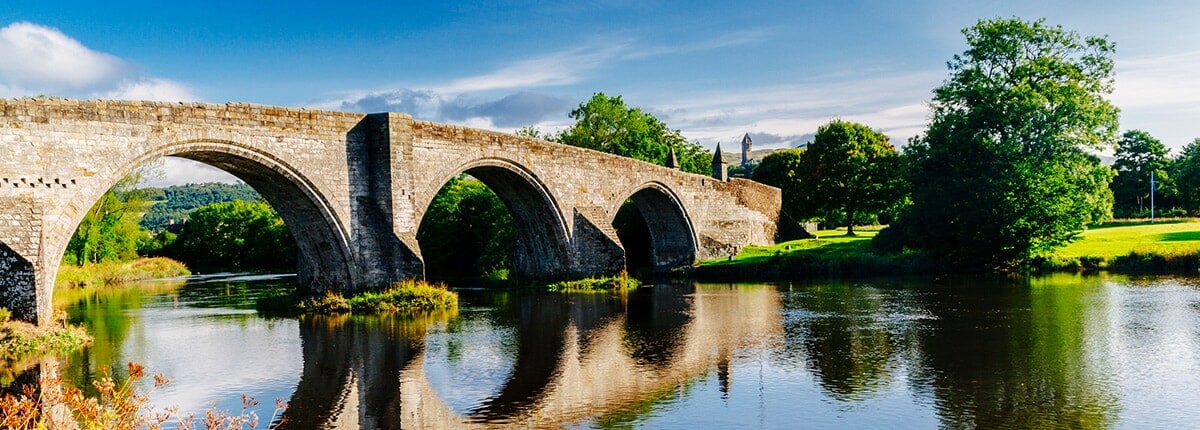 the stirling bridge surrounded by green trees in edinburgh, scotland