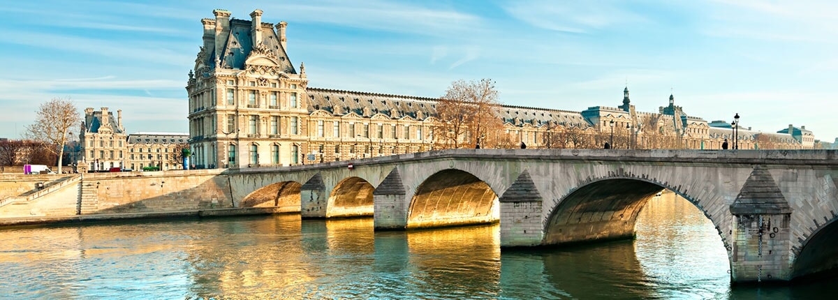 pont royal bridge and the louvre museum in paris, france