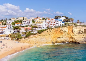 beautiful carvoeiro with colorful houses by beautiful, sandy beach