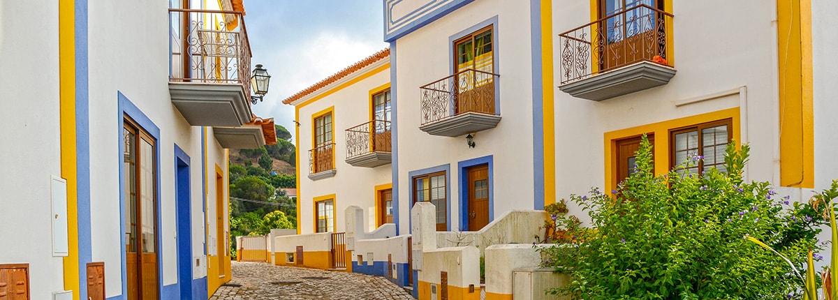 residential street with bright, colorful homes in portimao, portugal