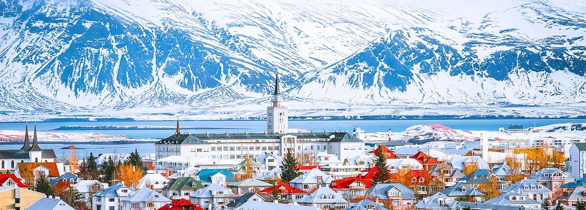 city of reykjavik with the mountains in the background
