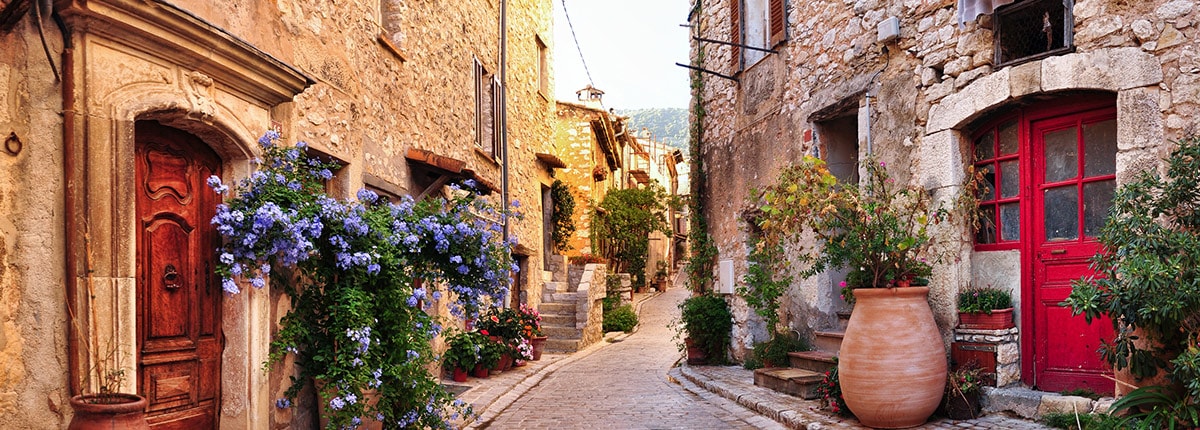 a toulon cobblestone street with flowers in france