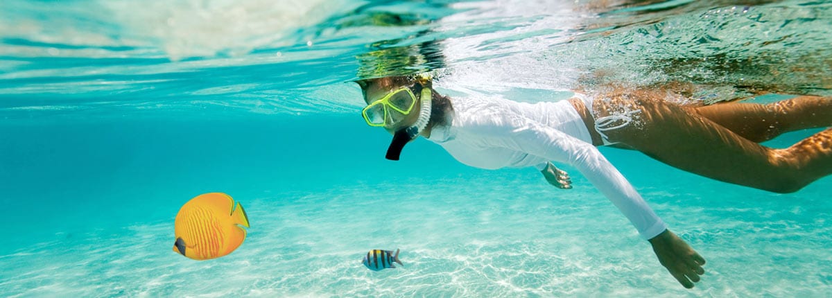 woman snorkeling in clear water