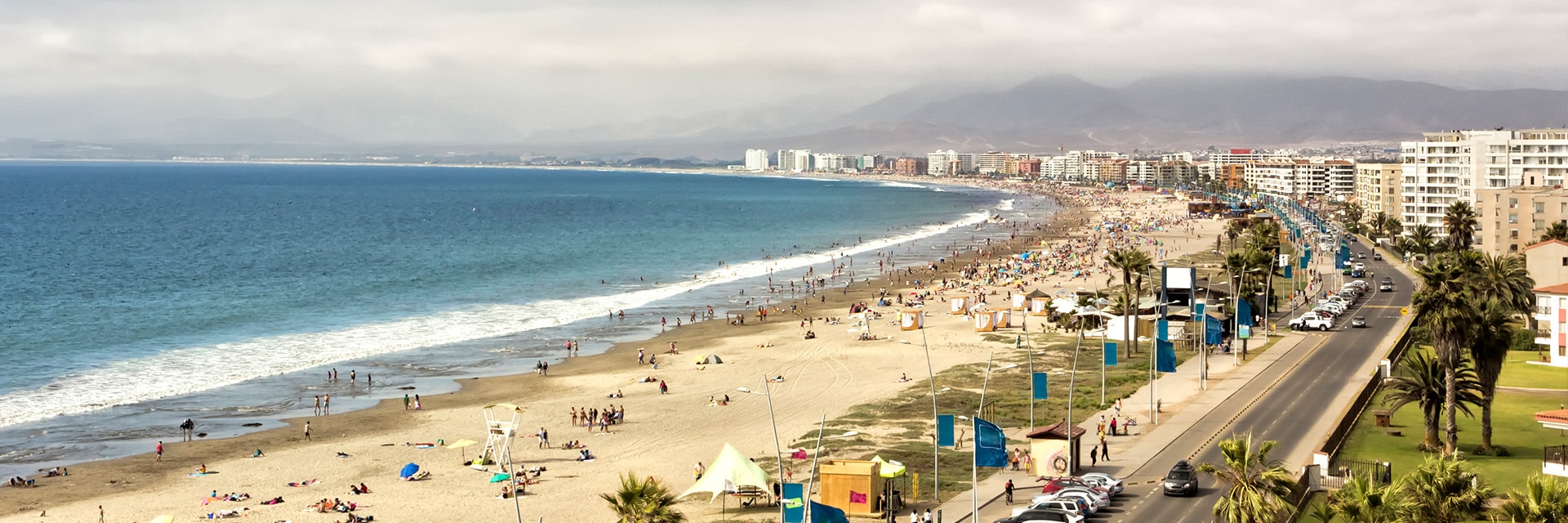 the tropical beach at la serena with mountains in the background