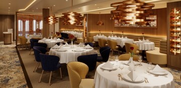 multiple dining tables inside the gold accent styled il viaggio restaurant 