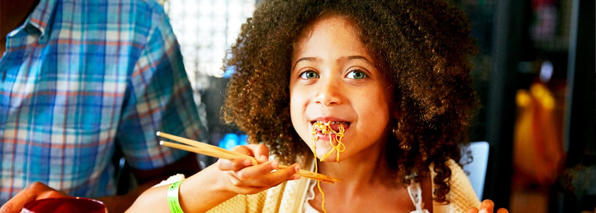 A child enjoying noodles at JI JI Asian Kitchen