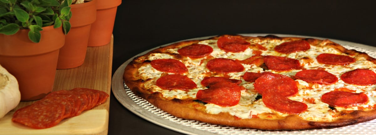 pepperoni pizza on a serving tray 