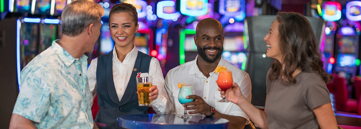 guests enjoying the drinks on us program at the carnival cruise line casino