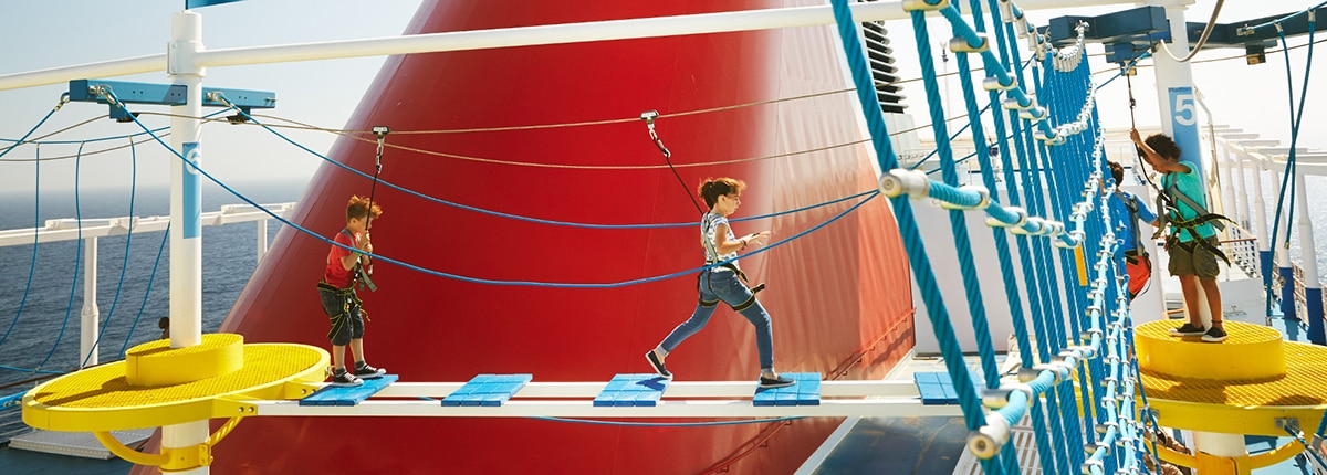 kids walking the ropes course on a carnival cruise