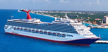 carnival conquest docked at a port with crystal blue waters