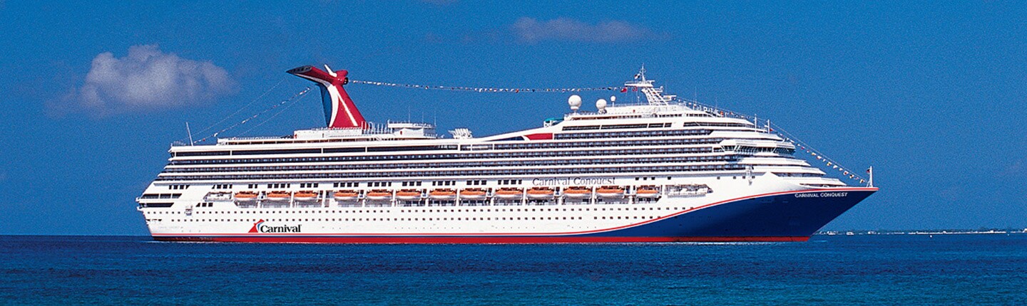 carnival conquest sailing at sea on a bright day