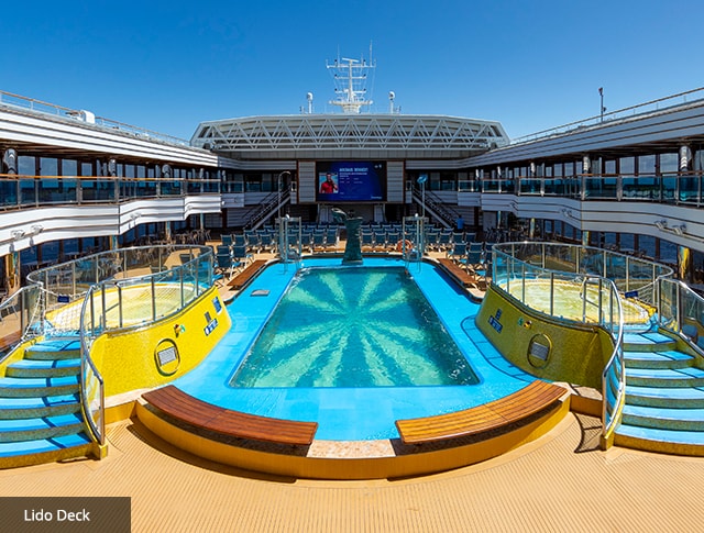 a large pool on the lido deck of carnival luminosa