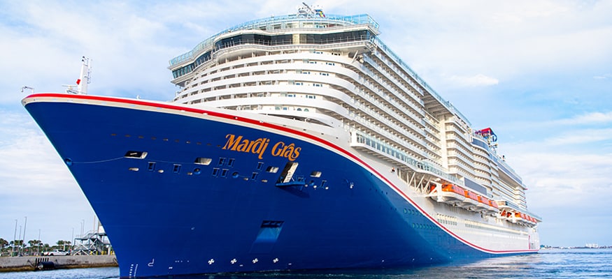 the front view of mardi gras is decorated with blue paint and the mardi gras logo