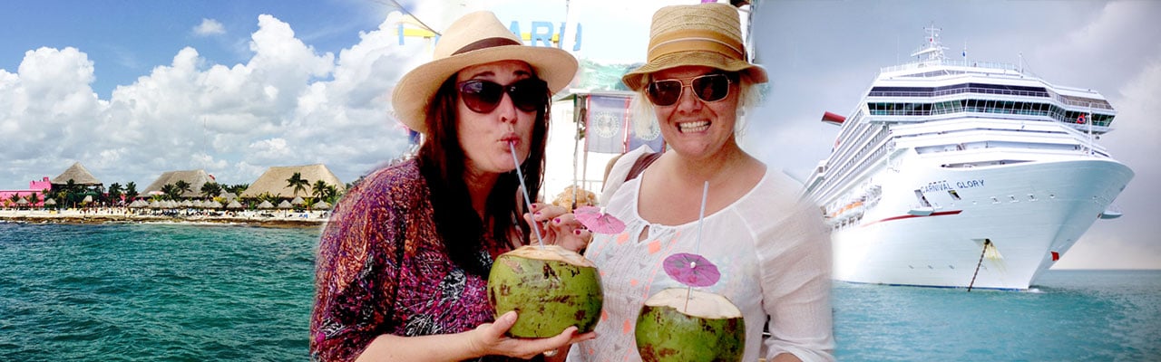 Two women holding coconuts simile and sip straws with a cruise ship behind them