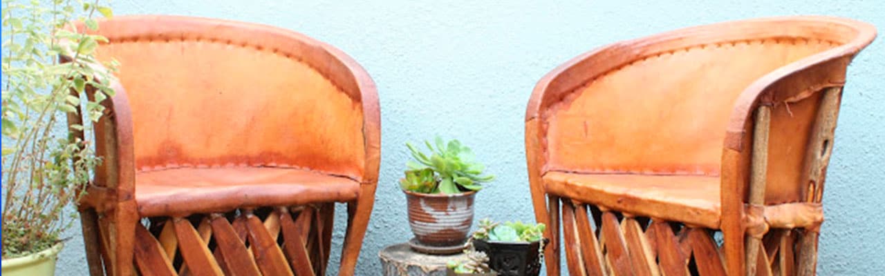 Two leather wooden chairs