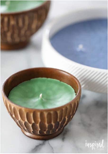 Wider view of small candle holder with green candle