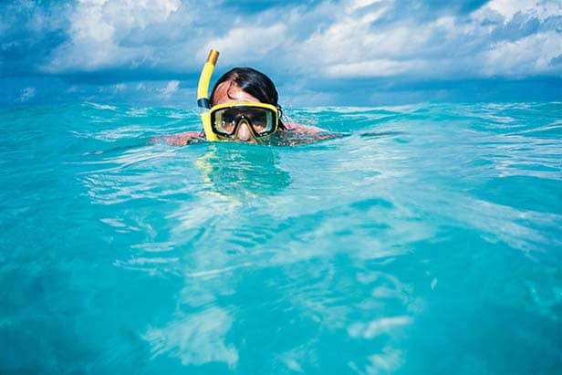 man snorkeling in bermuda