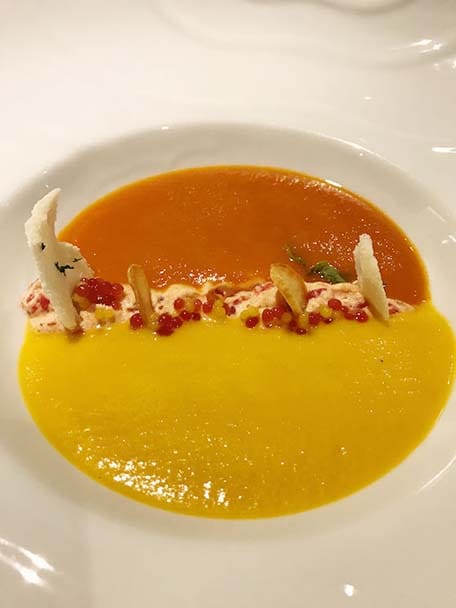 Orange and yellow side by side soup served on the Carnival Sunshine