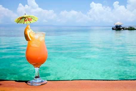 bahama mama drink with a view of the beach