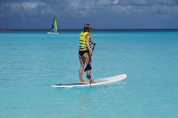 Sarah paddle boarding in Half Moon Cay