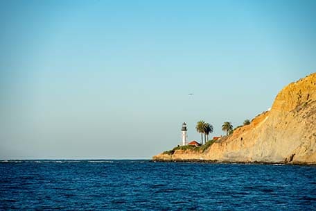 a lighthouse along the cliffs in ensenada mexico