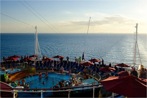 The pool deck during sunset on the Carnival Vista