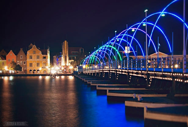 Pier in Curacao lit up with colorful lights at night