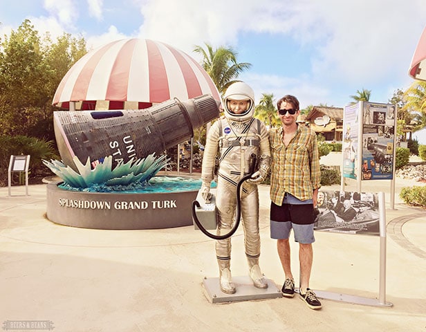 Randy posing with an astronaut statue at that Splashdown Grand Turk exhibit