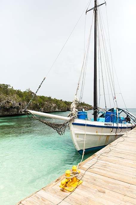 White sail boat tied up on a dock on Catalina Island, Dominican Republic