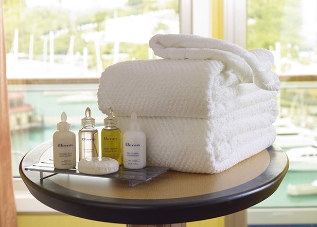 a stack of spa bath towels and soaps