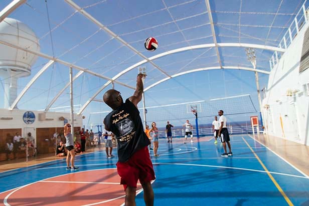a group of people playing volleyball at sportsquare