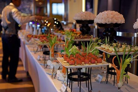 a server at a wedding buffet on a cruise