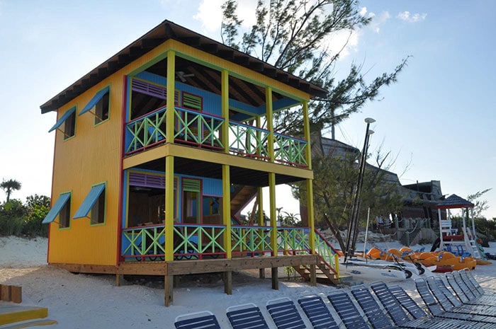 a yellow beach villa located in half moon cay, the bahamas