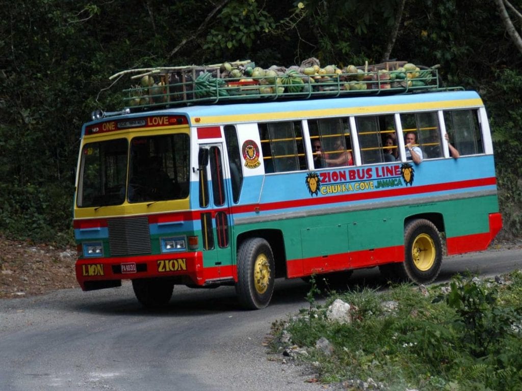 guests riding the zion bus to chukka cove in jamaica