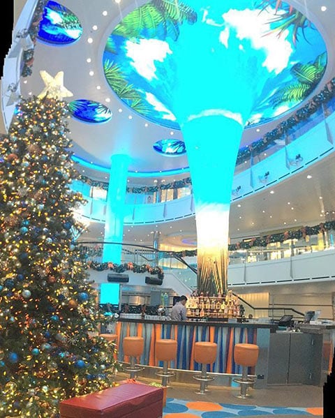 a Christmas tree in the atrium of the Carnival Vista