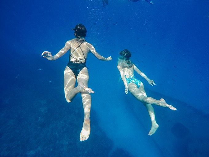 Tess & Sarah snorkel underwater at USS Kittiwake
