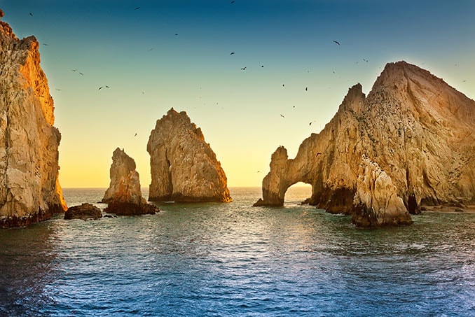 sunrise at the arch of cabo san lucas in mexico