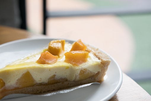 delicious mango cheese cake on a plate