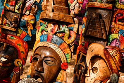 hand-made, wooden masks in different colors and sizes