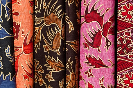  different colored batik fabrics depicting a bird on display