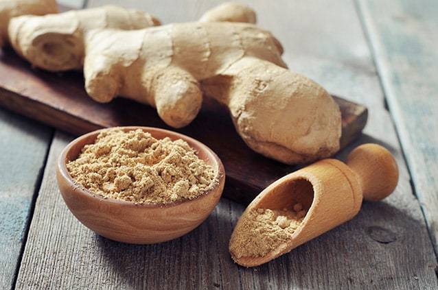 ginger root and ginger powder in a bowl