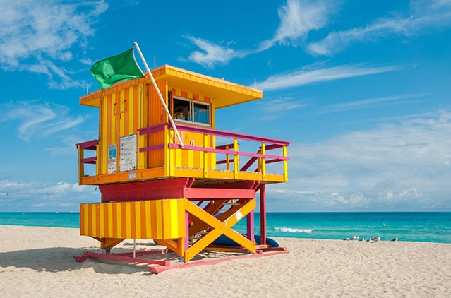 yellow and orange lifeguard tower in south beach