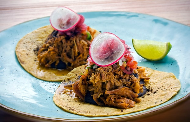 cochinita pibil tacos from belize served with lime