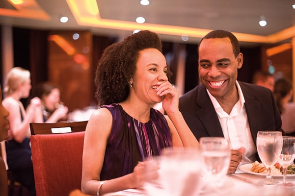married couple enjoying specialty meal on carnival ship