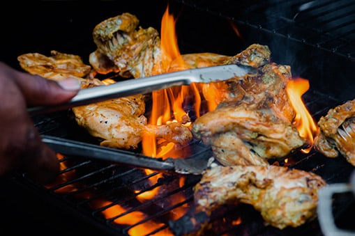 jerk chicken from tortola being barbequed on a grill