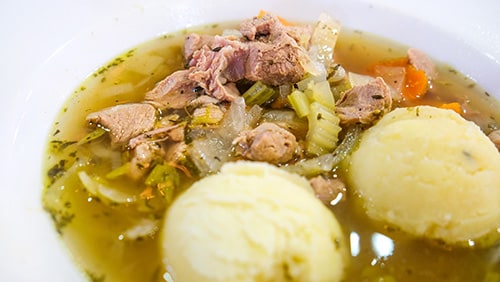 fungee, a hearty beef stew served with pepperpot, cornmeal made from okra